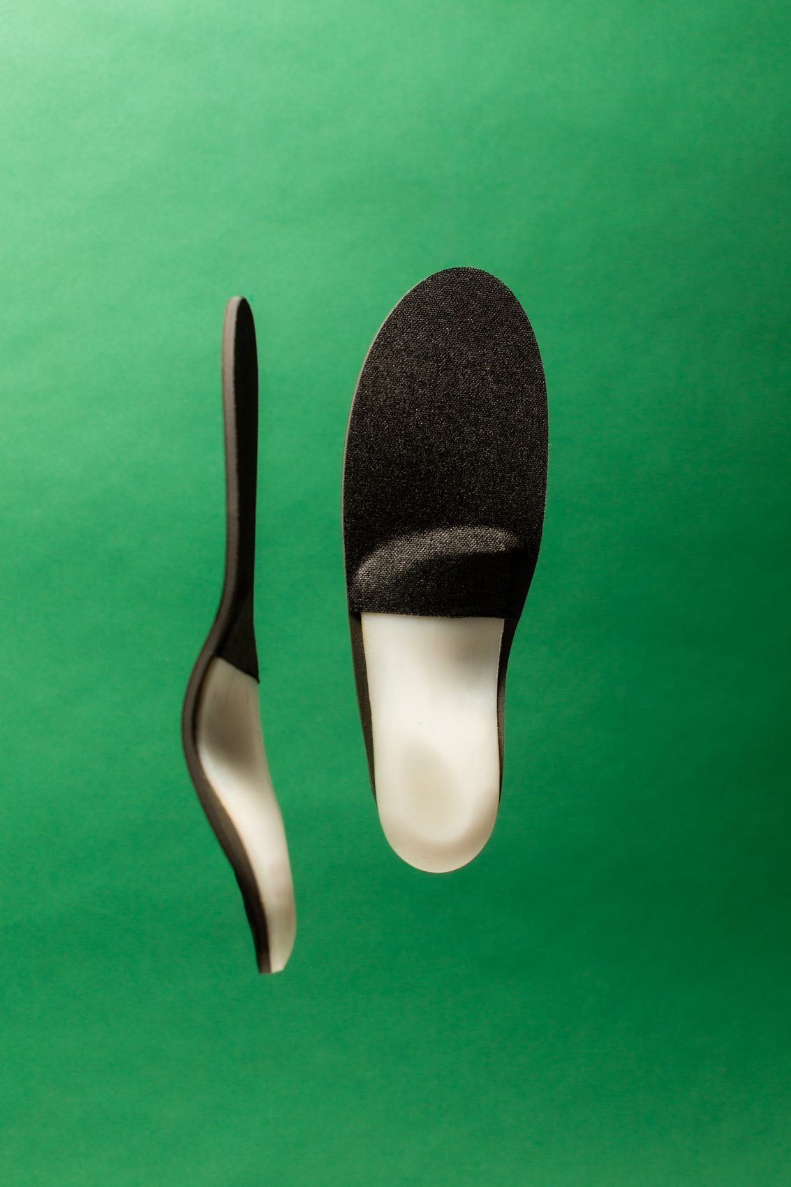 A ReLEAF orthotic in side profile beside a top-down view, showing the contoured arch.